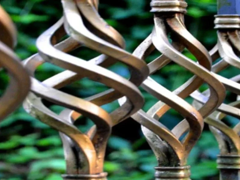 Close detail of decorative scrolled steel balustrade panels