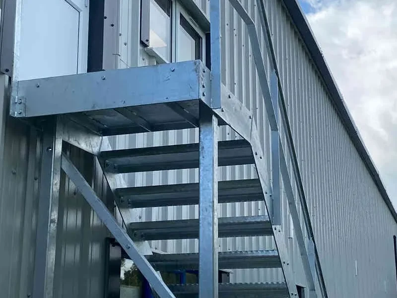 External steel fire escape staircase to a first floor industrial unit