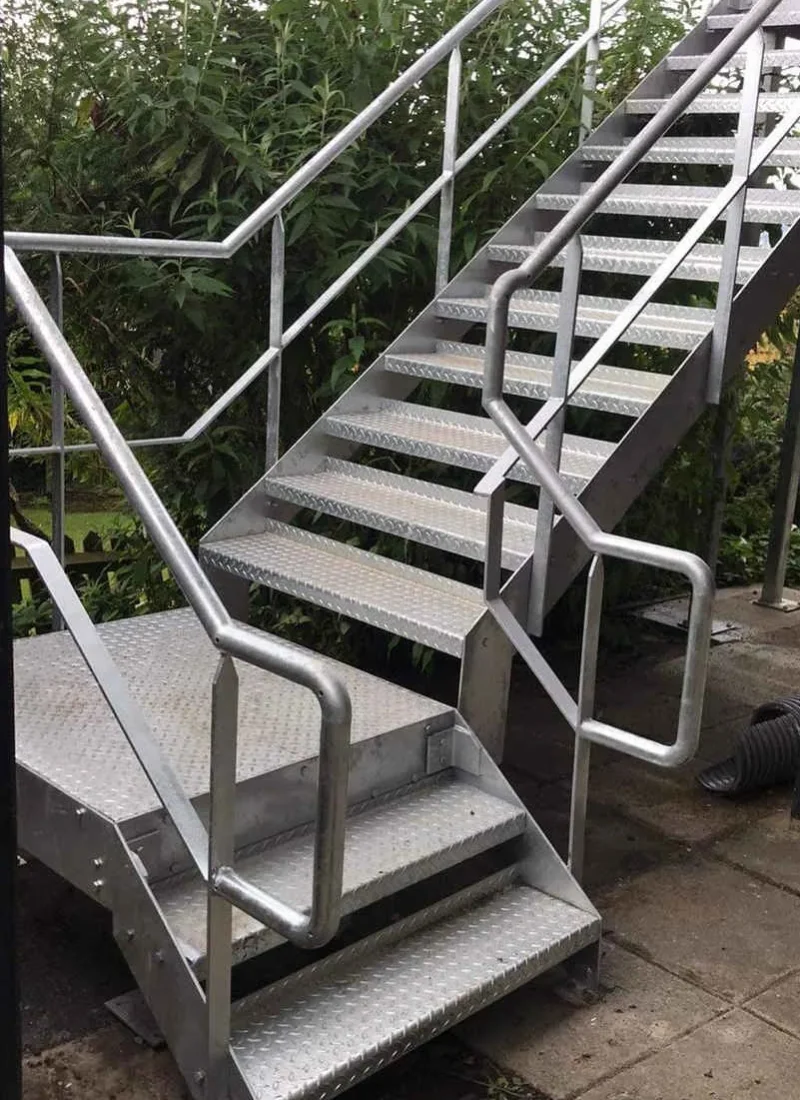 External galvanised staircase with a half landing and turn