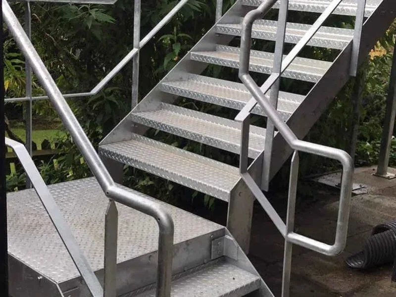External galvanised staircase with a half landing and turn
