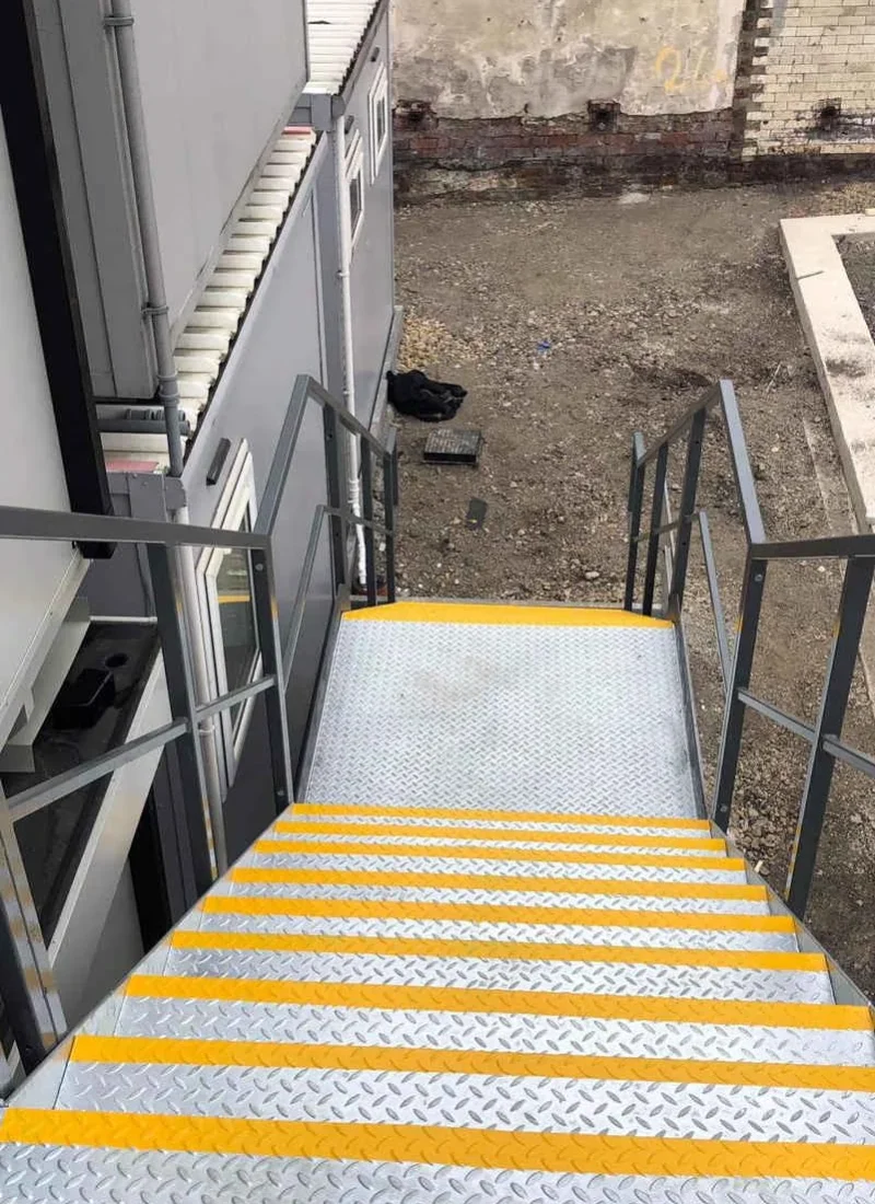 Fire escape treads with yellow anti-slip nosings to current regulations