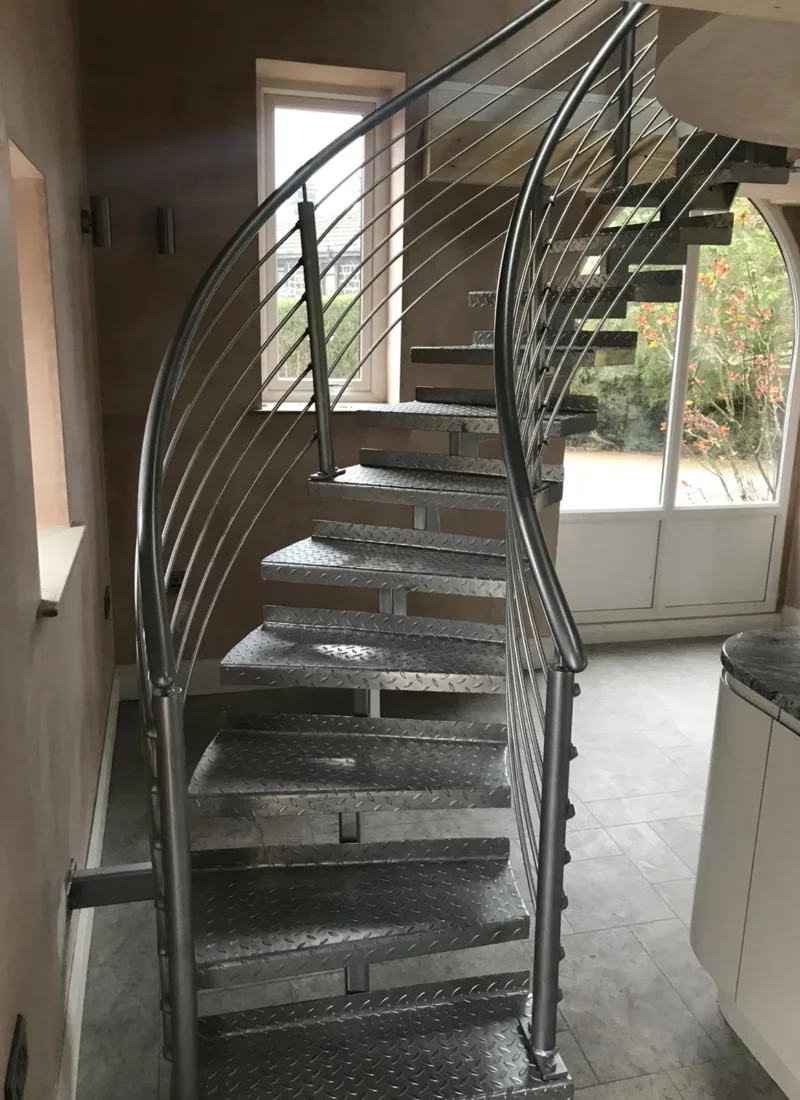 Helical steel staircase with stainless steel balustrade and open treads