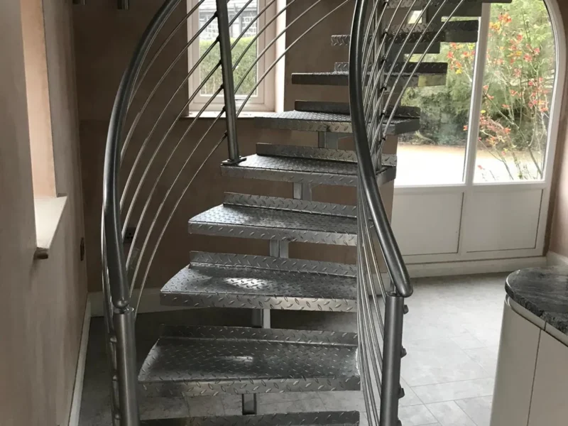 Helical steel staircase with stainless steel balustrade and open treads