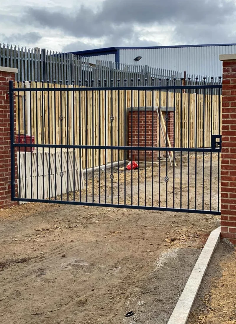 Steel sliding gate securing a commercial yard entrance