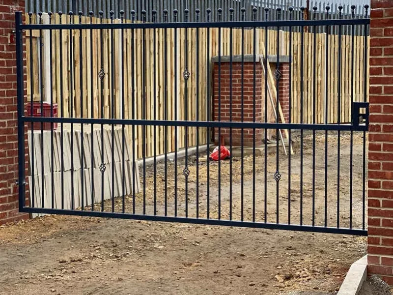 Steel sliding gate securing a commercial yard entrance