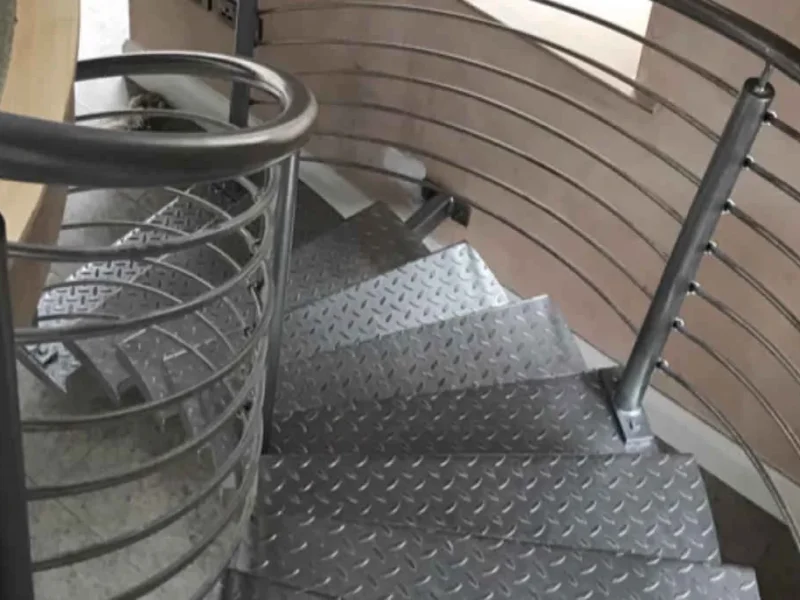 Detail of a spiral steel staircase with chequer plate treads