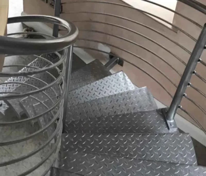 Detail of a spiral steel staircase with chequer plate treads