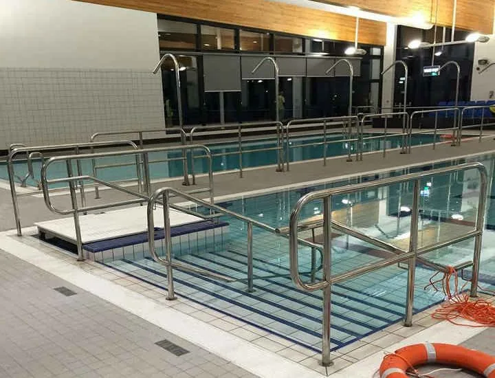 Stainless handrails and steps fabricated for a swimming pool installation