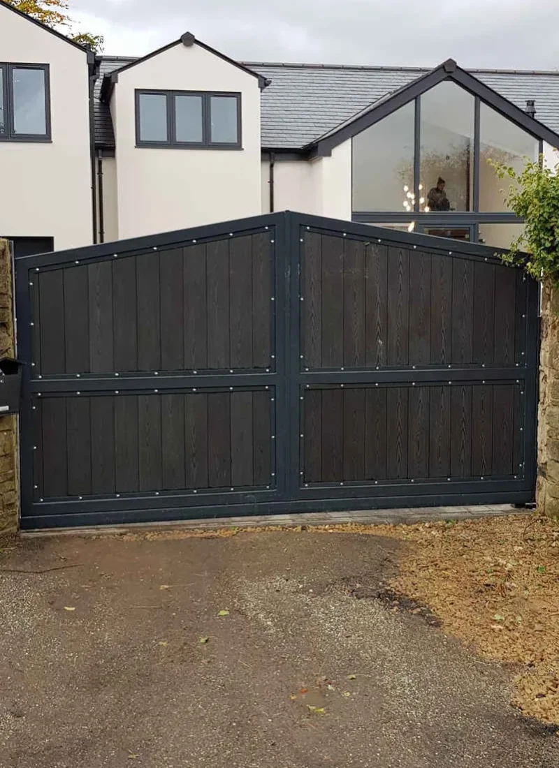 Timber clad steel-framed driveway gates